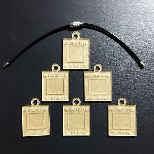 Acrylic charms to create rhinestone color swatches.