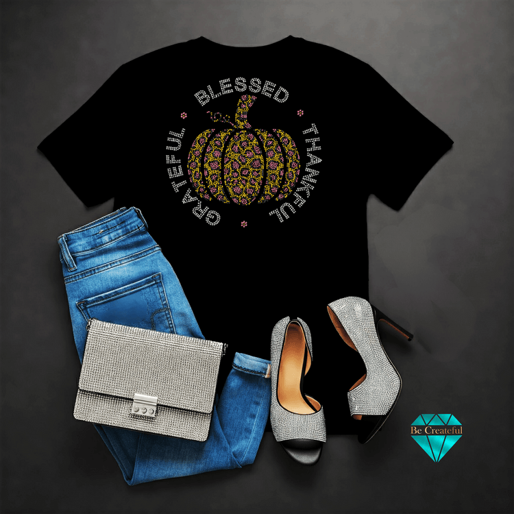 Grateful Thankful Blessed with pumpkin rhinestone transfer on black shirt, blue jeans, rhinestone shoes and purse.