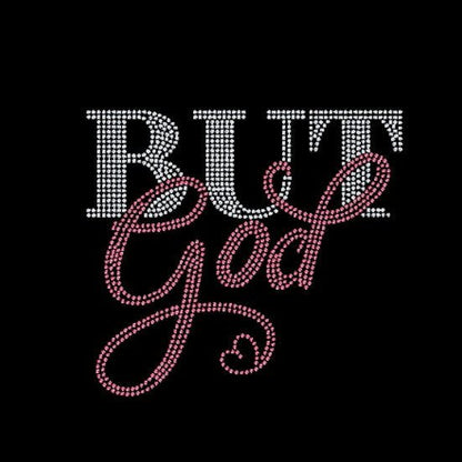 Text 'BUT God' with crystal and pink rhinestone embellishments on a black background