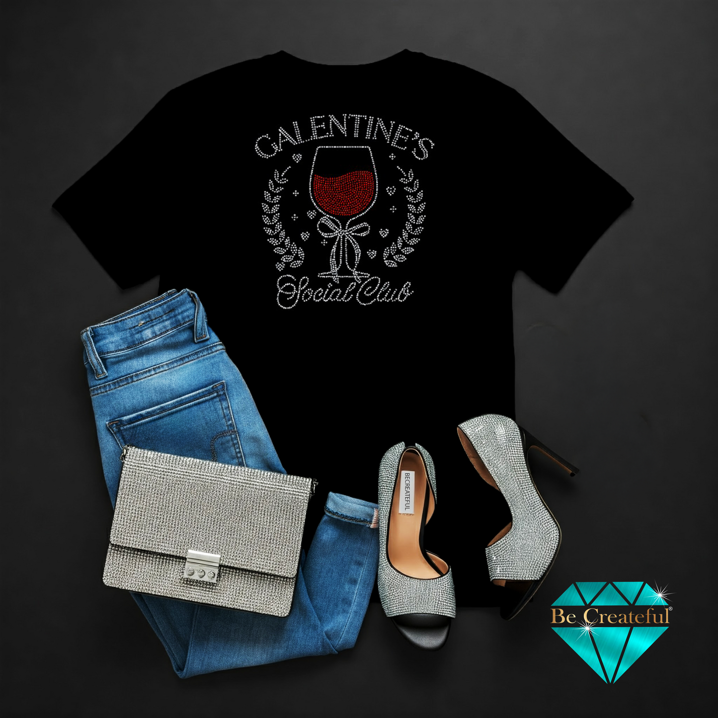 Black t-shirt with 'Galentine's Social Club' design, blue jeans, silver handbag, and high heels on a dark background.