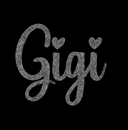 Black rhinestone design with  'Gigi' text, blue jeans, on a dark background.
