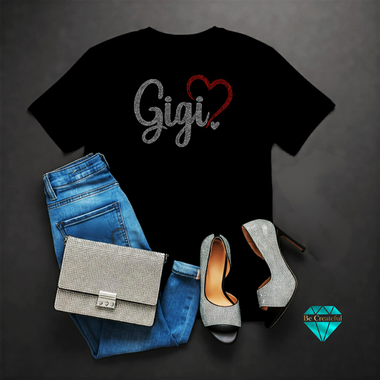 Black rhinestone t-shirt with 'Gigi' and heart design,  on a dark background.