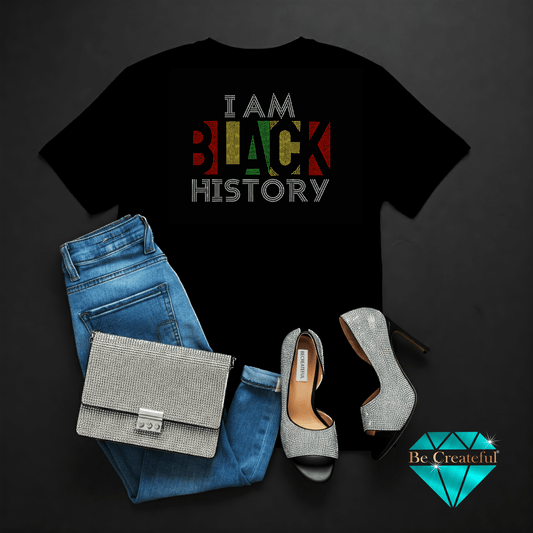 Black t-shirt with 'I AM BLACK HISTORY' text, blue jeans, silver handbag, and high heels on a dark background.