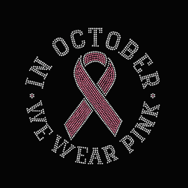 Pink breast cancer awareness ribbon with 'In October we wear pink' text on a black background