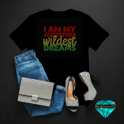 I am my ancestors wildest dreams rhinestone design on a lBlack t-shirt  blue jeans, silver handbag, and high heels on a dark backgroud