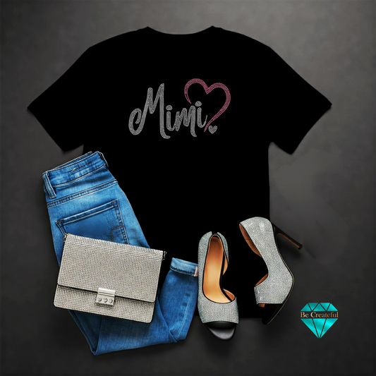 Mimi with pink heart rhinestone design on black shirt.