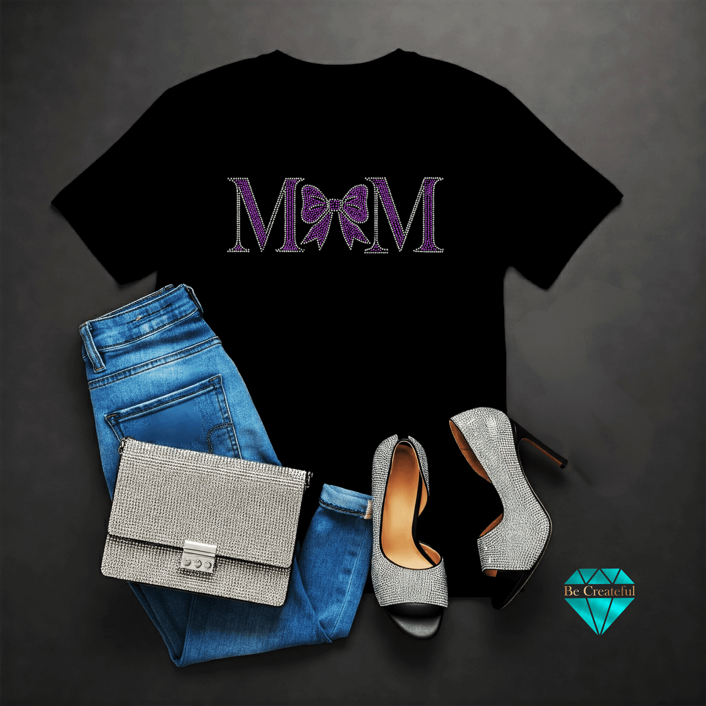 Black t-shirt with 'MOM' design, blue jeans, silver handbag
