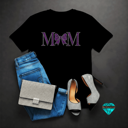 Black t-shirt with 'MOM' design, blue jeans, silver handbag