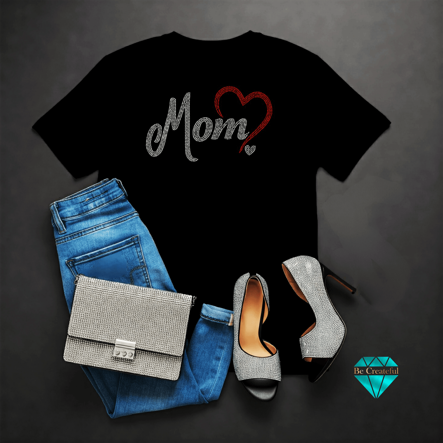 Black t-shirt with 'Mom' rhinestone design, blue jeans. Perfect for Mother's Day!