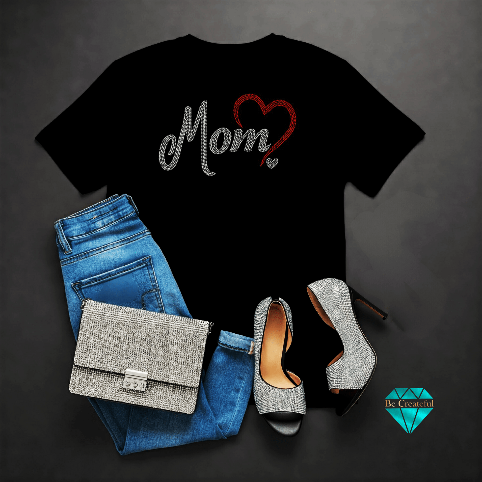 Black t-shirt with 'Mom' rhinestone design, blue jeans. Perfect for Mother's Day!