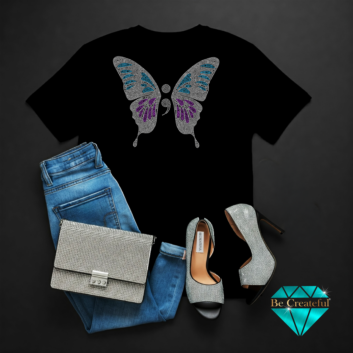 Black t-shirt with butterfly design, blue jeans, silver handbag, and high heels on a dark background.