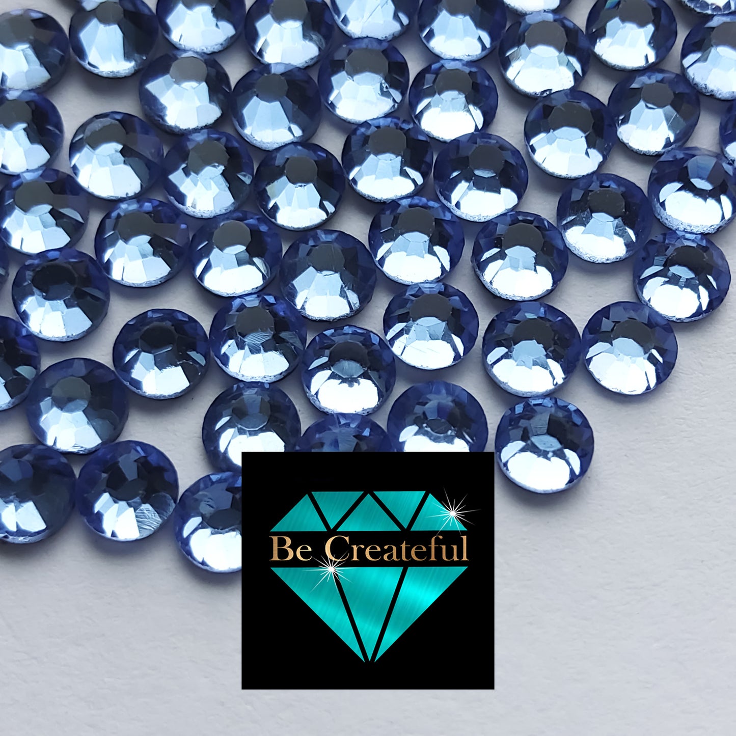 DMC Lt. Sapphire Glass Hotfix Rhinestones - Be Createful, Beautiful Rhinestones at wholesale prices.